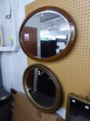 AN INLAID MAHOGANY OVAL WALL MIRROR AND ANOTHER OVAL WALL MIRROR (2)