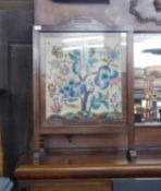 AN OAK FRAMED FLORAL TAPESTRY FIRE SCREEN