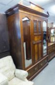 A LATE VICTORIAN WALNUTWOOD PART BEDROOM SUITE VIZ  TRIPLE DOOR WARDROBE, DRESSING TABLE WITH