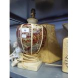 A CERAMIC URN SHAPED TABLE LAMP AND DOMED SILK SHADE