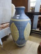 A LARGE BLUE AND CREAM POTTERY VASE, WITH CORK LID