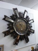 VERY LARGE 'WEST DECOR' MOULDED COMPOSITION SUNBURST WALL CLOCK, THE EIGHT LONGER SUNRAYS APPLIED