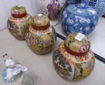 TRIO ALIKE OF MODERN CHINESE POTTERY GINGER JARS AND COVER, WITH A JAPANESQUE PRINTED AND PAINTED