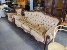 AN ITALIAN CARVED AND PIERCED WALNUT SHOW-FRAMED SUITE OF THREE SEATER SETTEE, A PAIR OF ARMCHAIRS