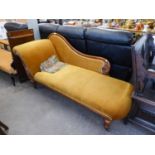 A VICTORIAN CARVED MAHOGANY SHOW-WOOD FRAMED CHAISE LONGUE WITH SINGLE SCROLL END, UPHOLSTERED AND