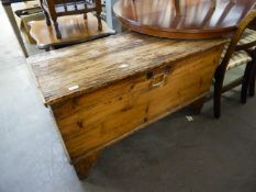 AN ANTIQUE PINE BEDDING BOX WITH HINGED LID (DISTRESSED)