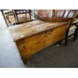 AN ANTIQUE PINE BEDDING BOX WITH HINGED LID (DISTRESSED)