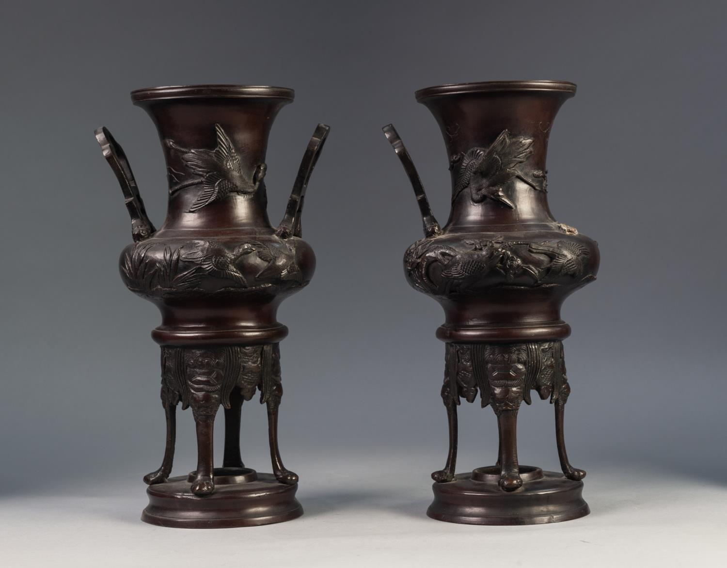 PAIR OF JAPANESE LATE MEIJI PERIOD TWO HANDLED PATINATED SPELTER VASES OR KOROS, each of campana