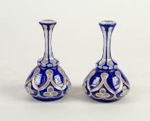 PAIR OF EARLY 20th CENTURY SMALL MALLET FORTM BLUE AND WHITE CAMEO GLASS VASES, the body cut with
