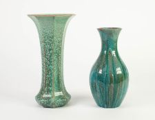 TWO PILKINGTONS PALE GREEN CURDLED OPALESCENT GLAZED POTTERY VASES, one of slender baluster form,