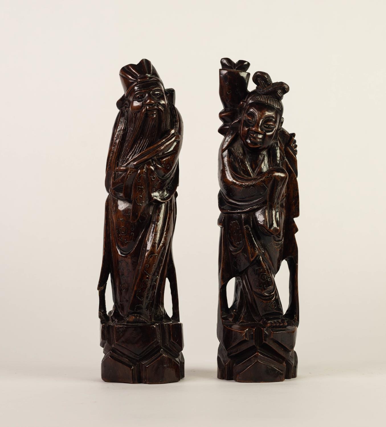 PAIR OF CHINESE LATE QING DYNASTY CARVED AND WIRE INLAID WOODEN IMMORTAL FIGURES, 11 1/2in (29cm)