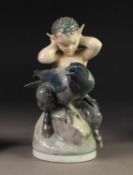 ROYAL COPENHAGEN CHINA GROUP OF A SATYR AND CROW, the satyr modelled with fingers in ears, on a