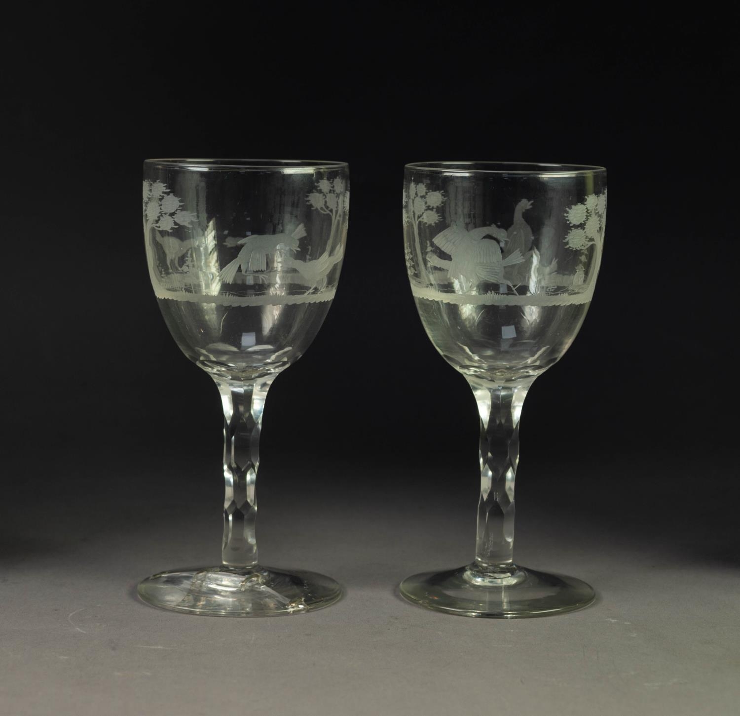 PAIR OF COCK FIGHTING ENGRAVED GLASS GOBLETS, each with wheel cut scenes to the bowl, above a