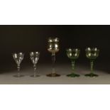 PAIR OF JAMES POWELL STEMMED DRINKING GLASSES, in green with folded foot, 5 ½? (14cm) high, together