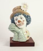 MODERN LLADRO PORCELAIN CLOWN?S HEAD, 5542, 11 ½? (29.2cm) high, on wood effect oblong base, printed