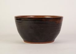 DAVID LEACH STYLE STUDIO POTTERY LARGE CIRCULAR DEEP BOWL with tenmoku glaze to the ribbed exterior,