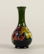 WALTER MOORCROFT HIBISCUS PATTERN TUBE LINED POTTERY VASE, of bottle form with slightly waisted neck