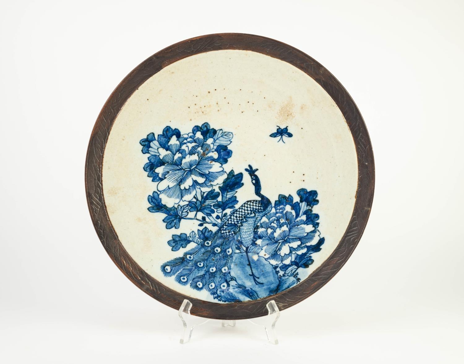 NINETEENTH CENTURY CHINESE BLUE AND WHITE POTTERY WALL PLAQUE WIT MANGANESE BORDER, of typical form,