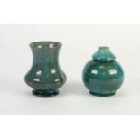 TWO PILKINGTONS BLUE CURDLED OPALESCENT GLAZED SMALL POTTERY VASES, one orbicular with compressed