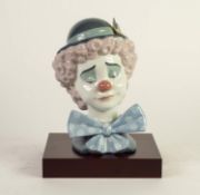 MODERN LLADRO PORCELAIN CLOWN?S HEAD, 5611, 8 ¼? (21cm) high, on wood effect oblong base, printed