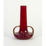 PILKINGTONS RED LUSTRE GLAZED TWO HANDLED POTTERY VASE, of compressed form with loop handles to