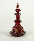 NINETEENTH CENTURY BOHEMIAN RUBY GLASS AND GILT DECANTER AND STOPPER, of tiered, lobated form with