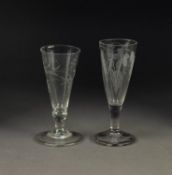 TWO ALE GLASSES WITH ENGRAVED TRUMPET SHAPED BOWLS, each wheel cut with fruiting vines, 6? (15.