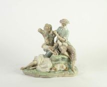 LLADRO PORCELAIN GROUP, painted in muted tones and modelled as a romantic couple seated, she being
