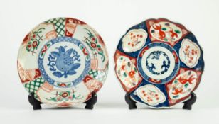 PAIR OF JAPANESE IMARI PORCELAIN SHALLOW DISHES OR PLAQUES, typically decorated, 8 1/4in (21cm)