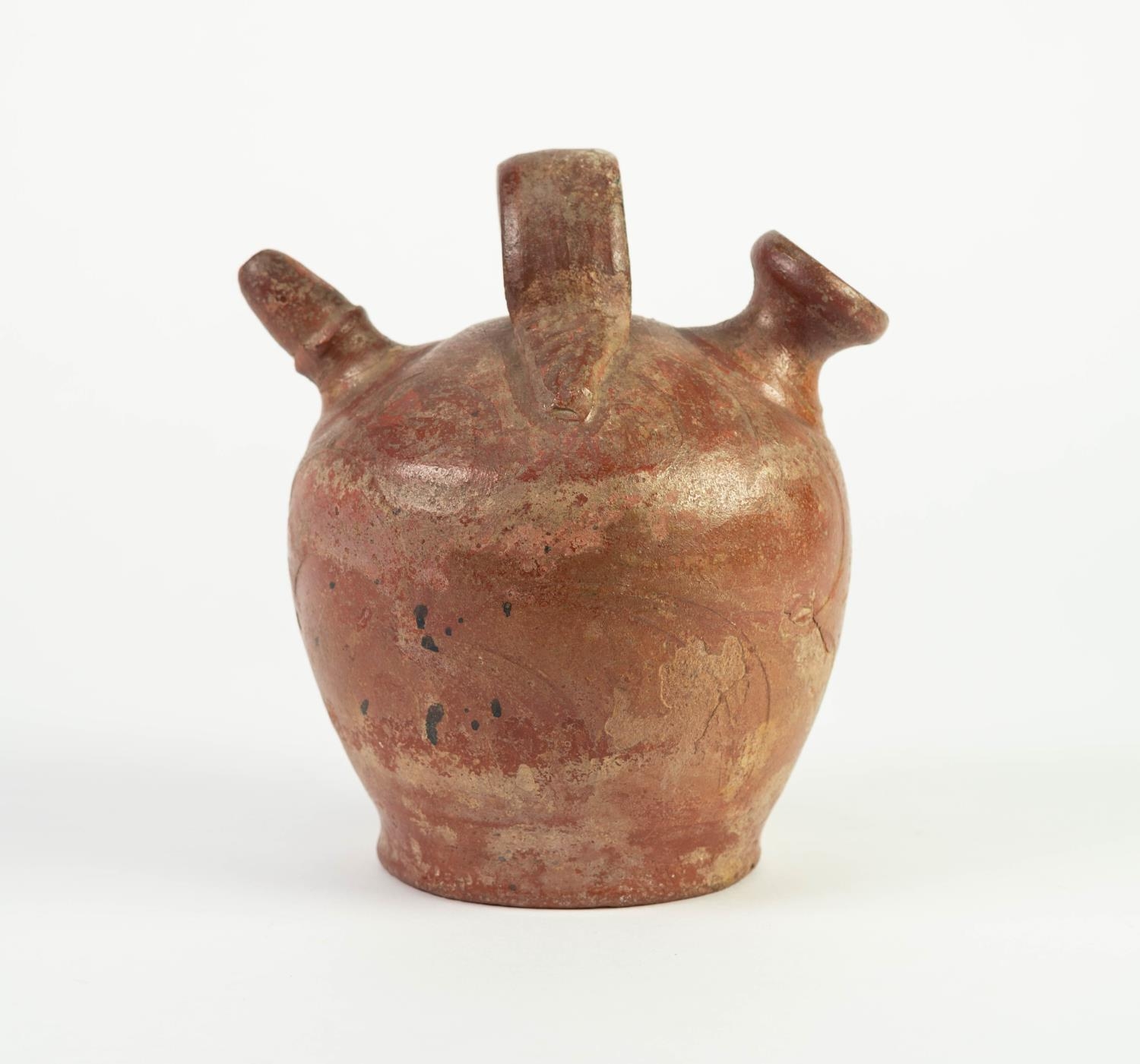 AGED COLUMBIAN BURNISHED EARTHENWARE VESSEL, with central loop handle and shaped spout, 6 3/4in (