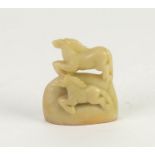 CHINESE PALE CELADON JADE CARVING OF TWO HORSES, 3in (7.5cm) high