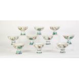 SUITE OF TEN CHINESE PORCELAIN, PROBABLY LATE QING, DYNASTY FENCAI ENAMELLED STEM BOWLS, each