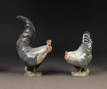 PAIR OF ROYAL COPENHAGEN CHINA MODELS OF CHICKENS, painted in muted tones and modelled as a cockerel