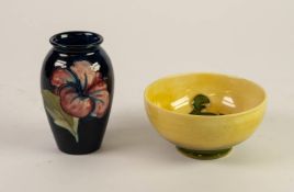 TWO PIECES OF WALTER MOORCROFT HIBISCUS PATTERN TUBE LINED POTTERY, comprising: OVOID VASE ON