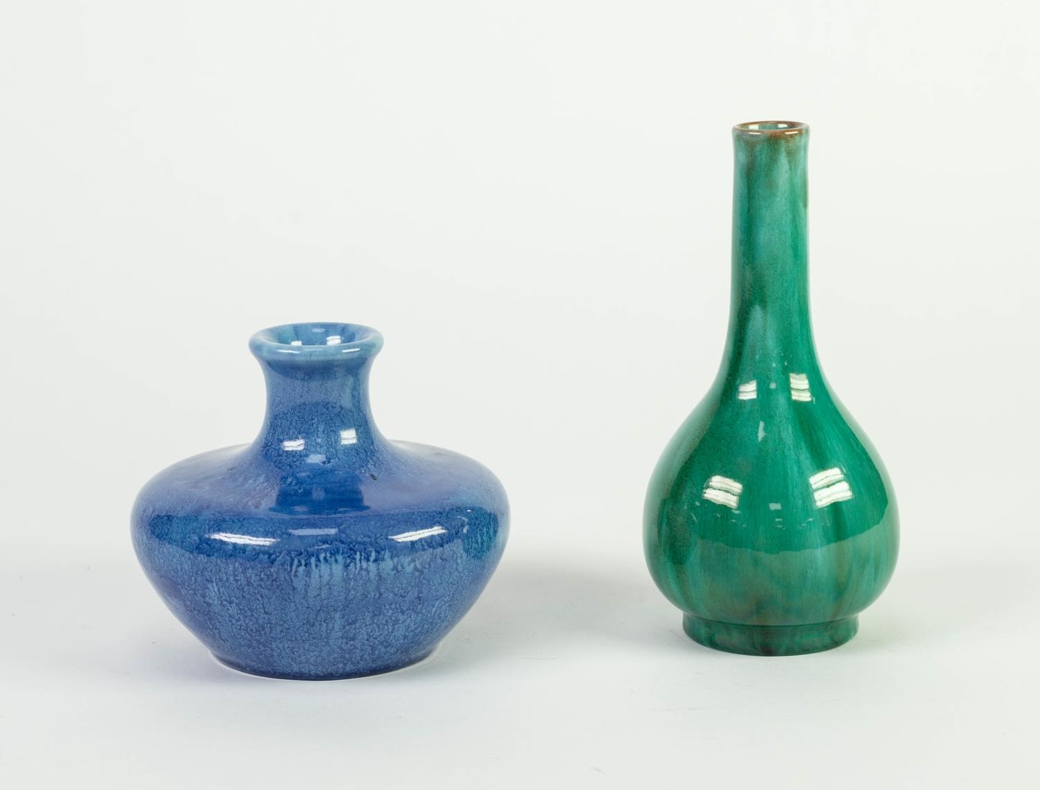 TWO PILKINGTONS OPALESCENT GLAZED POTTERY VASES, one of compressed form in blue, 4 ¼? (11cm) high (