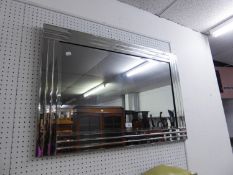 AN ART DECO STYLE RECTANGULAR WALL MIRROR, TRIPLE STRAND FLUTED MIRROR GLASS FRAME