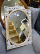 AN OVAL WALL MIRROR, IN FLORAL CARVED AND PIERCED RECTANGULAR FRAME, 2?1? X 1?5? OVERALL