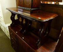 A NEST OF THREE DARK MAHOGANY COFFEE TABLES, ON TRESTLE END SUPPORTS