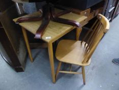 A SMALL BEECHWOOD SQUARE KITCHEN TABLE AND A PAIR OF COMB BACKED SINGLE CHAIRS WITH PANEL SEATS (3)