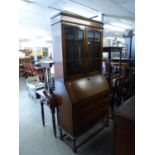 1920?s  OAK BUREAU BOOKCASE, THE SUPERSTRUCTURE BOOKCASE ENCLOSED BY TWO PANE PANEL GLAZED DOORS,
