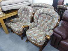 A HARD WOOD FRAMED COTTAGE LOUNGE SUITE OF FOUR PIECES WITH RAIL BACKS AND LOOSE BACK AND SEAT