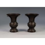 PAIR OF JAPANESE LATE MEIJI PERIOD BRONZE VASES, each of flared form, engraved with panels