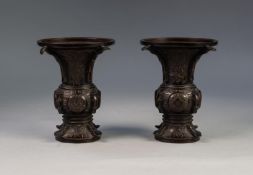 PAIR OF JAPANESE LATE MEIJI PERIOD BRONZE VASES, each of flared form, engraved with panels