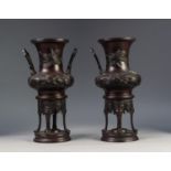 PAIR OF JAPANESE LATE MEIJI PERIOD TWO HANDLED PATINATED SPELTER VASES OR KOROS, each of campana