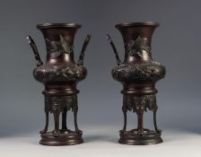 PAIR OF JAPANESE LATE MEIJI PERIOD TWO HANDLED PATINATED SPELTER VASES OR KOROS, each of campana