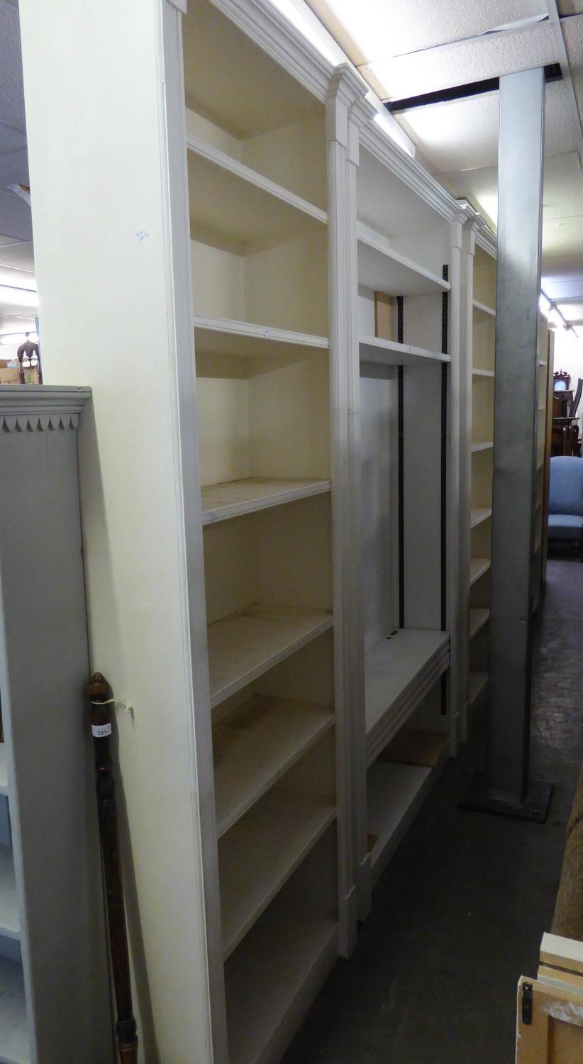 A WHITE PAINTED OPEN BOOKCASE OF SEVEN TIERS, 4? WIDE AND A PAIR OF MATCHING BOOKCASES, 2?6? WIDE (