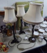 A PAIR OF 'BRONZED' METAL EMPIRE STYLE CANDLESTICK ELECTRIC TABLE LAMPS AND ANOTHER (3)