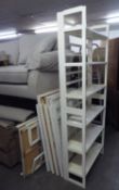 A RANGE OF FOUR WHITE PAINTED 6 TIER OPEN BOOKCASES, EACH 3? WIDE, 6?1? HIGH