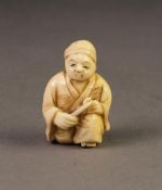 JAPANESE MEIJI PERIOD CARVED IVORY NETSUKE OF A SEATED STREET VENDOR, 1 ½? (3.8cm) high