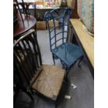 AN EARLY TWENTIETH CENTURY OAK RUSH SEAT TALL BACK SINGLE CHAIR AND A GREEN PAINTED IRON GARDEN